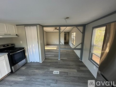 A kitchen with a stove top oven and a microwave.