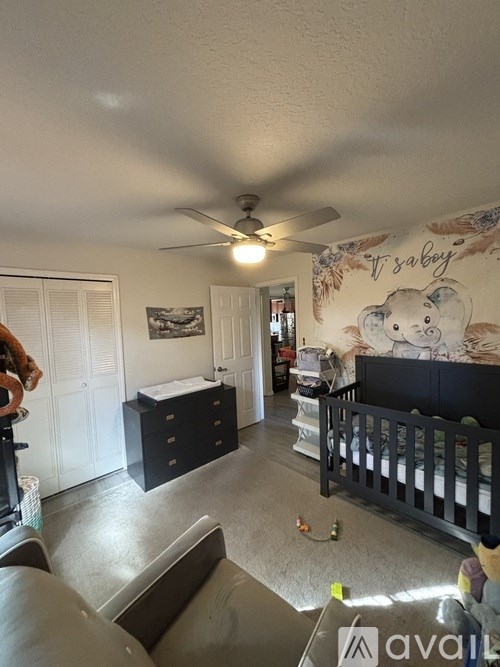 A baby room with a crib and a teddy bear.