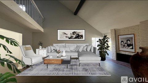 A living room with a white couch and a coffee table.
