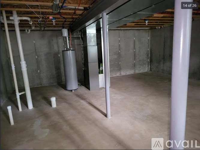 A room with a water filtration system and a door.