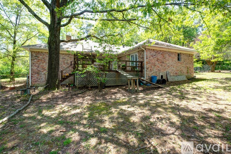 A house with a tree in front of it.