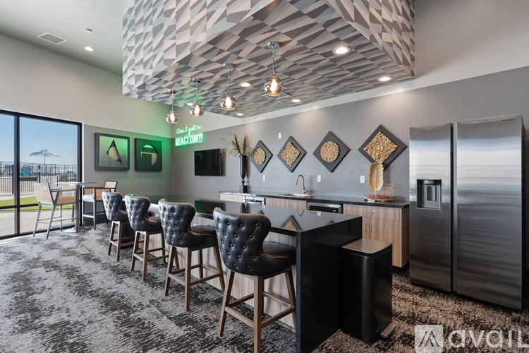 Source URL: https://prod-avail.s3.amazonaws.com/public_images/41503132/listing/Sevenotwmain_10172024_clubhouse_chairs_bar.jpg