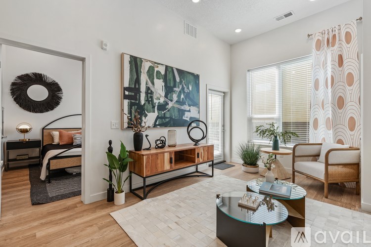 Source URL: https://prod-avail.s3.amazonaws.com/public_images/41503163/listing/Sevenotwmain_10172024_living_room_with_bedroom.jpg