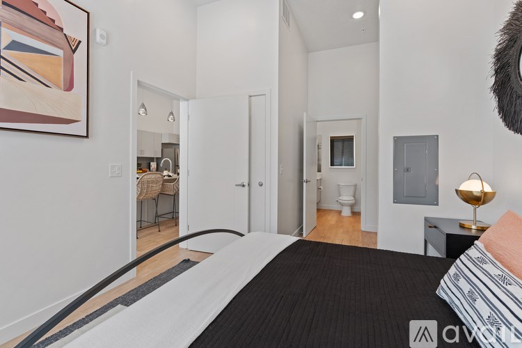 Source URL: https://prod-avail.s3.amazonaws.com/public_images/41503126/listing/Sevenotwmain_10172024_bedroom__looking_into_bathroom.jpg