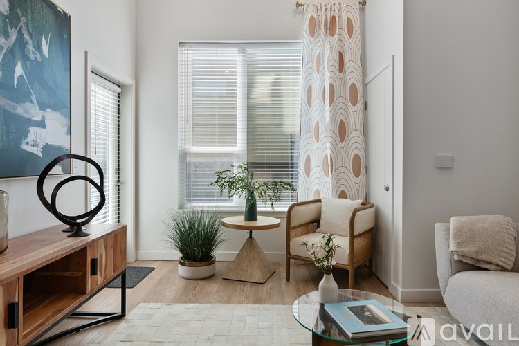 Source URL: https://prod-avail.s3.amazonaws.com/public_images/41503164/listing/Sevenotwmain_10172024_living_room_with_window.jpg