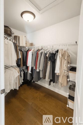 A bathroom with a tub, toilet, and sink.