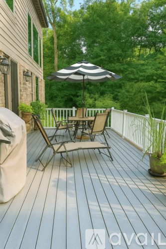 A large house with a well-maintained garden in front.