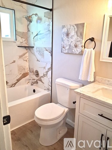 A towel is hanging on a hook on a bathroom counter.