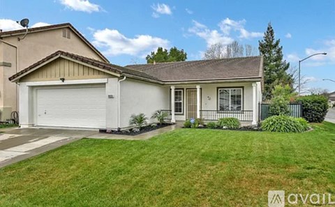 A house with a garage is for sale.