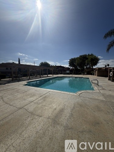 A sunny day at the outdoor swimming pool.