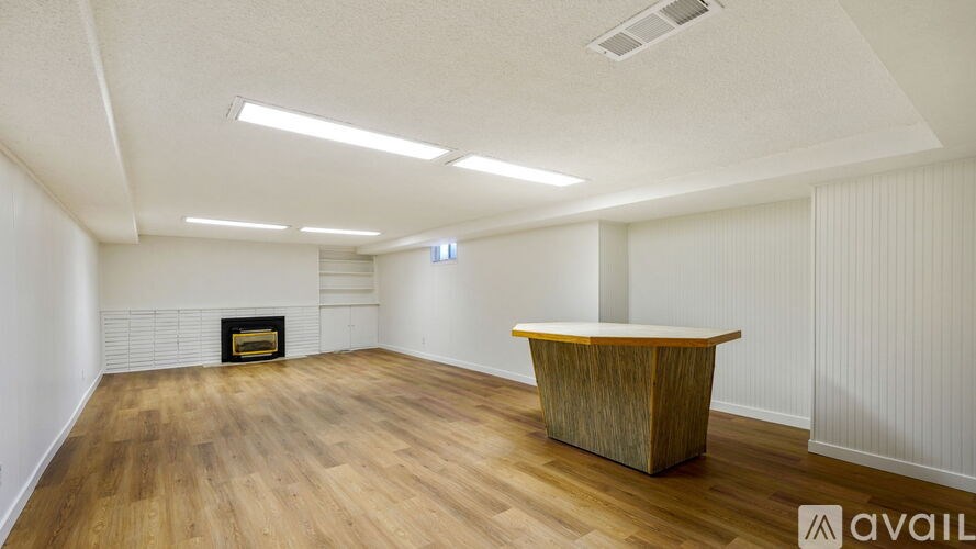 Source URL: https://prod-avail.s3.amazonaws.com/public_images/41513215/listing/Int_bsmnt_living_room_fireplace.jpg