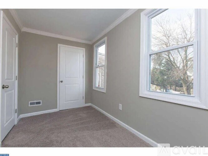 A room with a door and a window.