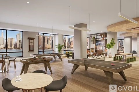 A modern living room with a pool table and a view of the city.