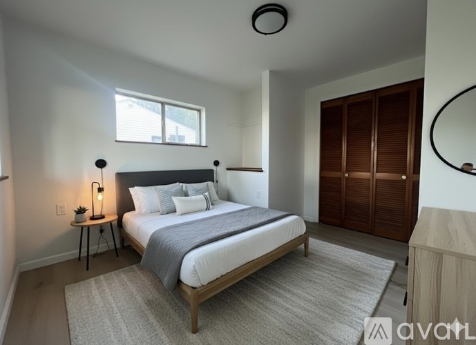A kitchen with a stove top oven and a microwave above it.