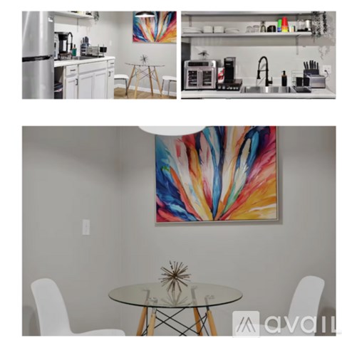 A kitchen with a modern design and a glass table with chairs.