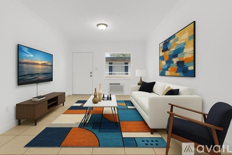 A living room with a white couch, a wooden chair, and a painting on the wall.