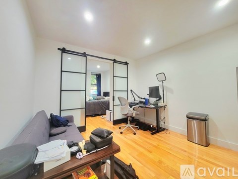 A living room with a grey couch and a wooden coffee table.