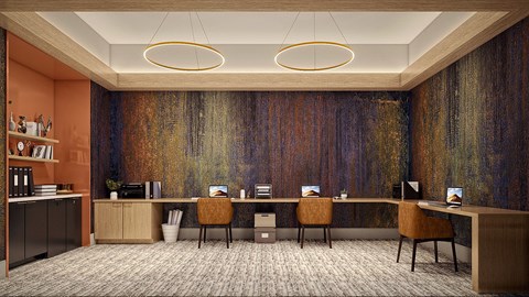 A room with a long desk and chairs with a large painting on the wall.