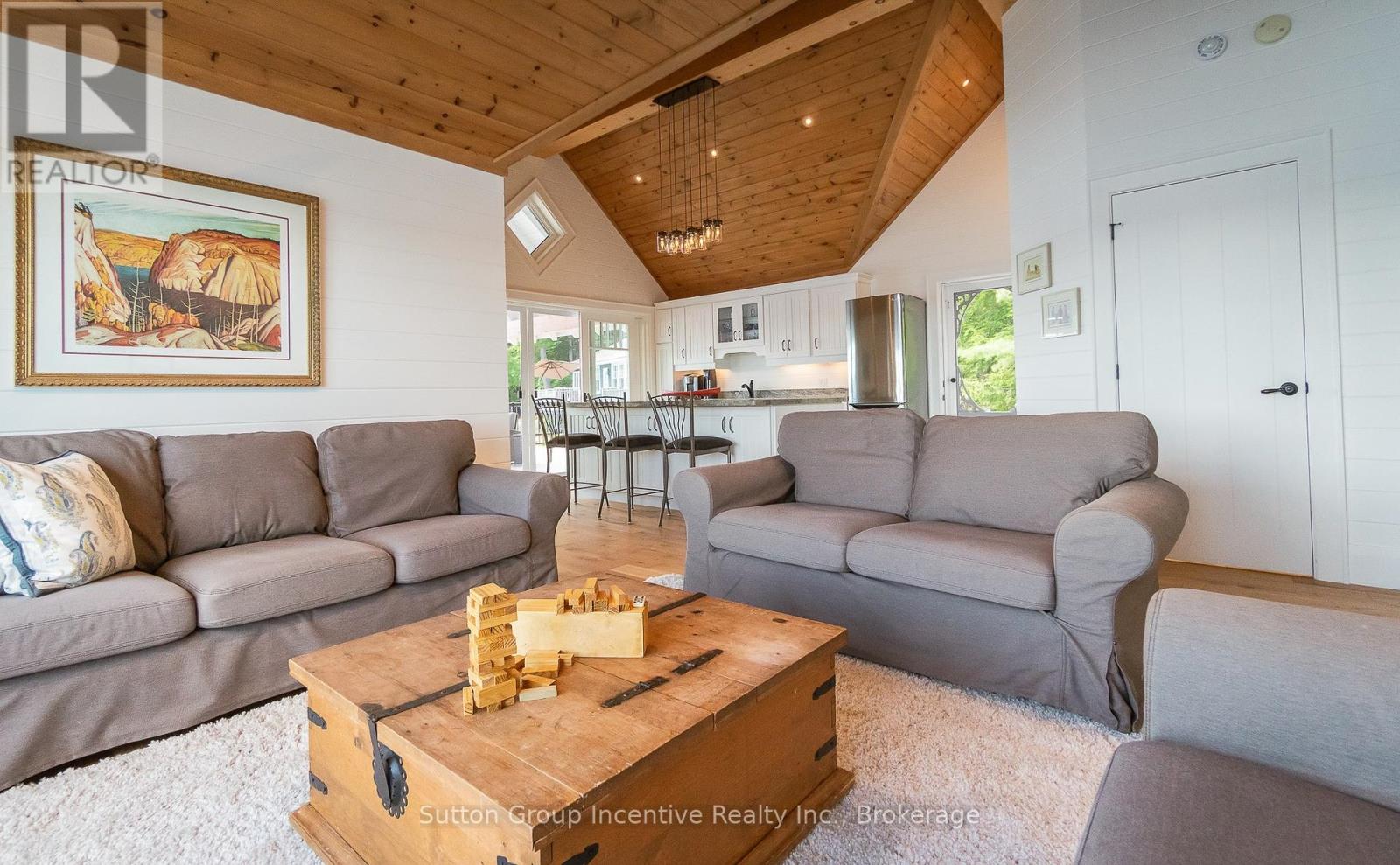 A living room with a wooden coffee table and grey couches.