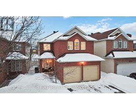 A house with a snow-covered front yard.