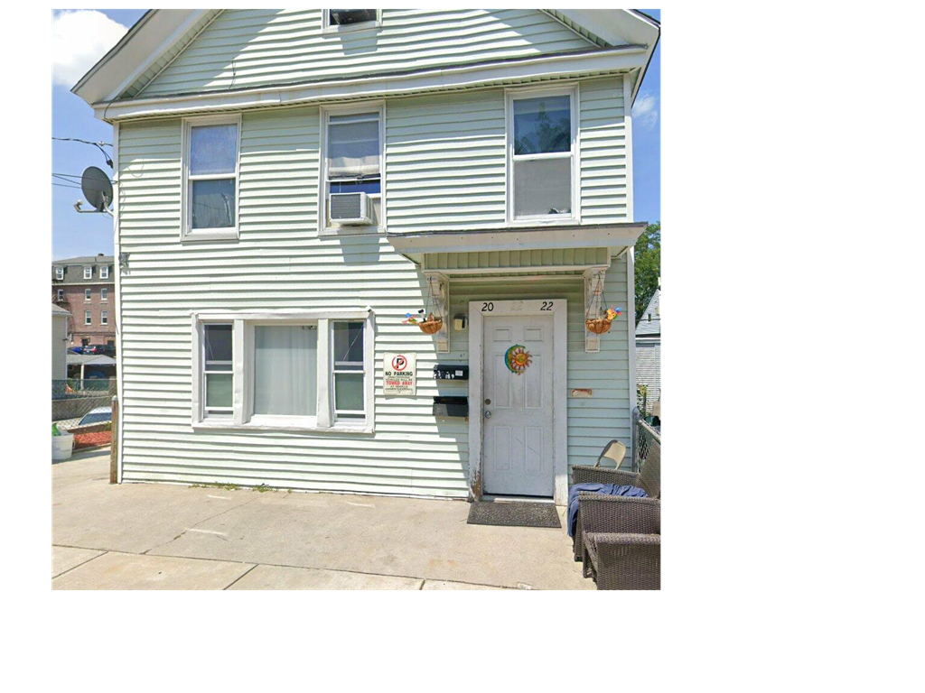 A two-story house with a white door and windows.