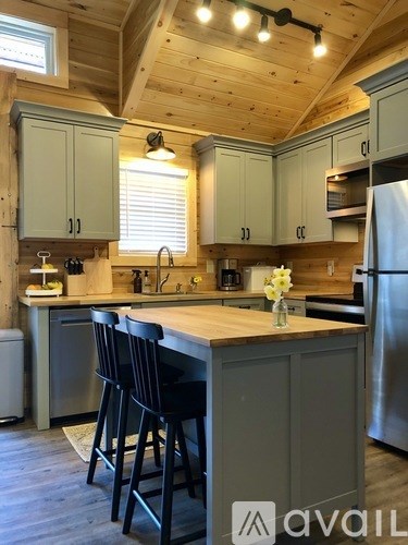 A kitchen with wooden cabinets and a white countertop.