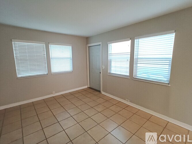 A kitchen with a sink and cabinets.