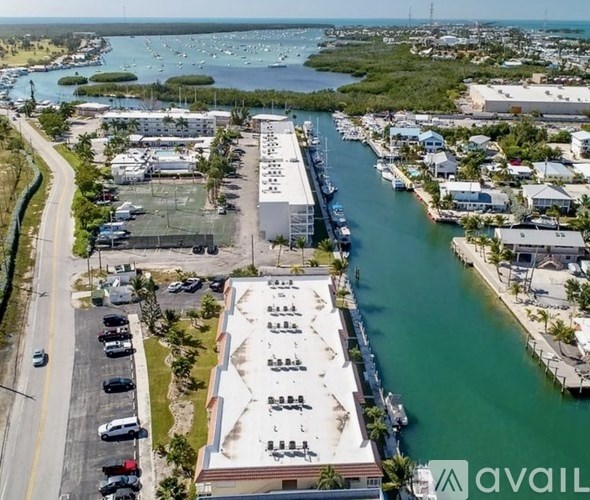 A large building with a parking lot in front of it.