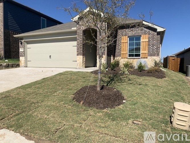 A house with a tree in front of it.