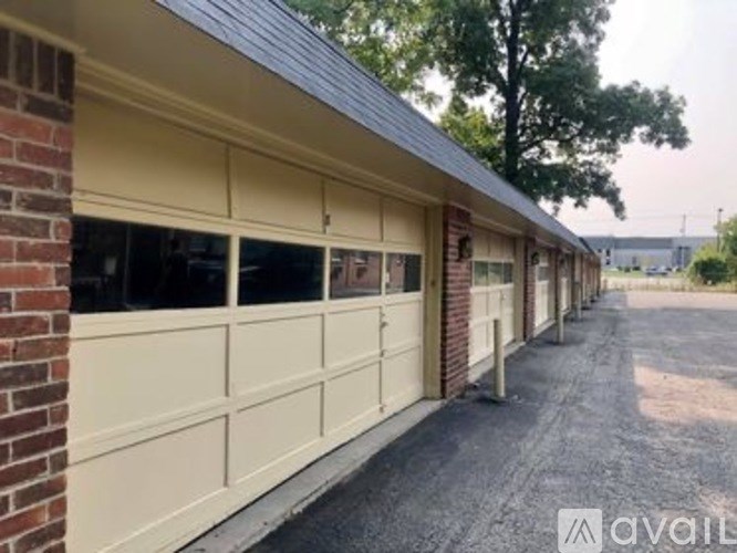 A long row of garage doors are closed.