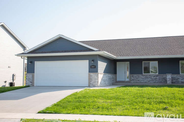 A house with a garage and a driveway.