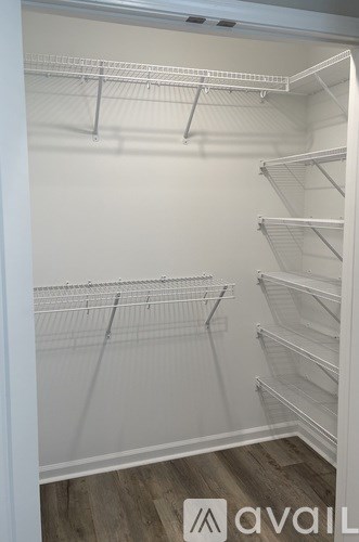 Empty white shelves in a room.