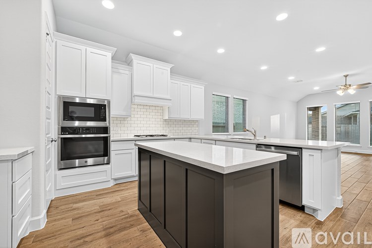 A modern kitchen with a large island in the center.