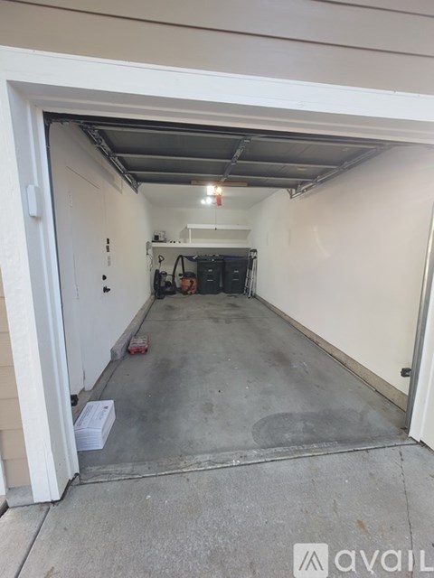 A garage with a white door is available for rent.