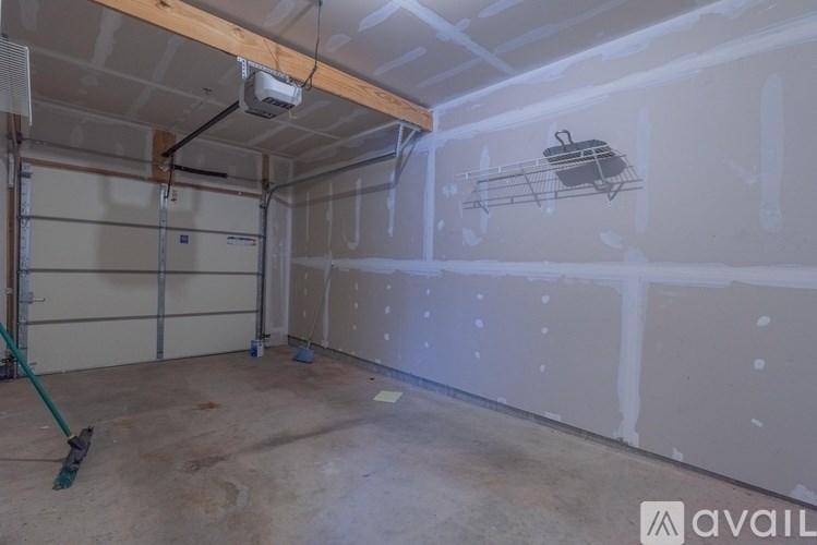 A room under construction with a wall covered in drywall.