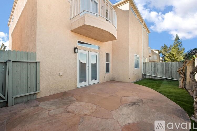 A house with a stone pathway leading to the front door.