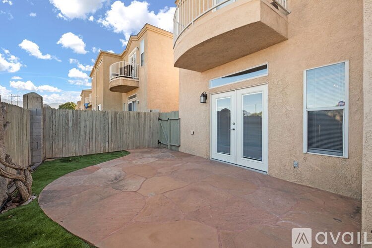 A house with a patio and a fence.