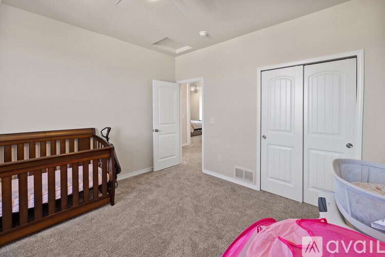 A baby's room with a crib and a changing table.
