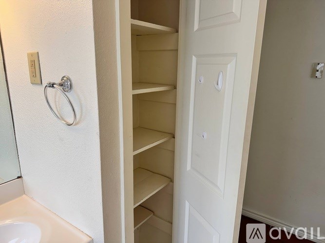 A white door with a ring on it.