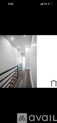 A long hallway with a railing on the left side.