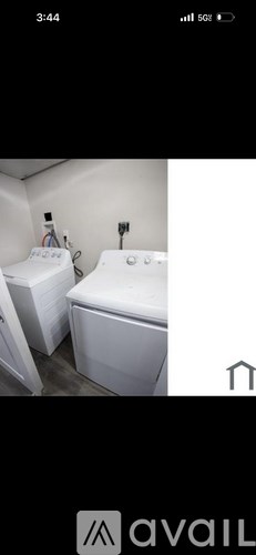 A white toilet and sink in a small bathroom.