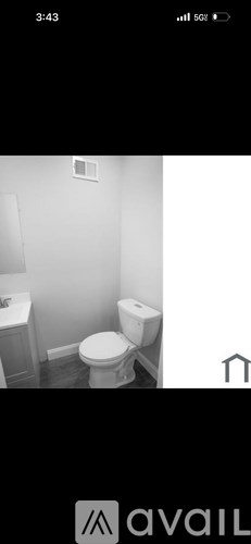 A bathroom with a toilet and sink.