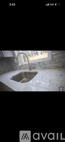 A sink in a room under construction.