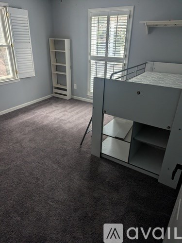 A bathroom with two sinks and a large mirror.