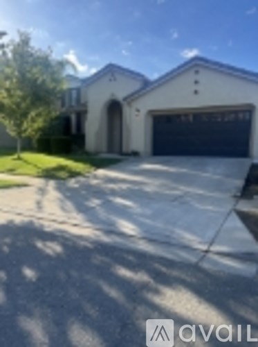 A house with a driveway in front of it.