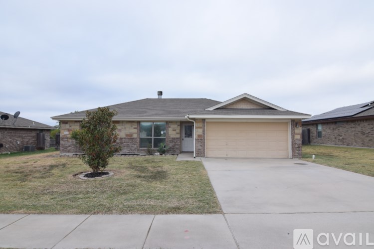A house with a garage and a driveway.