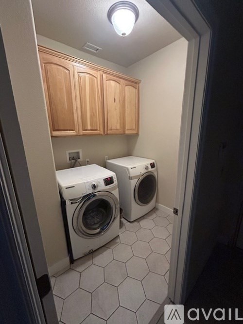 A laundry room with a washer and dryer.