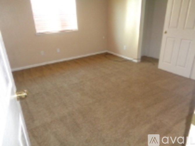 A room with a door and a window.