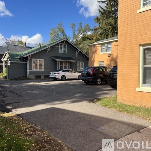 A house with a car parked in front of it.