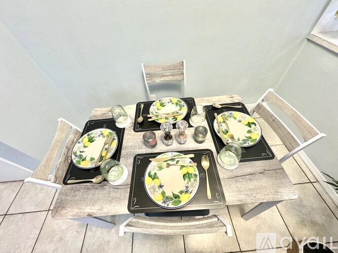 A table set for a meal with plates, glasses, and utensils.